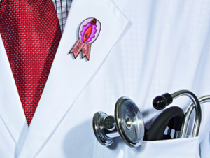 closeup of a doctor with a stethoscope in his pocket and a sexual health pin on his lapel